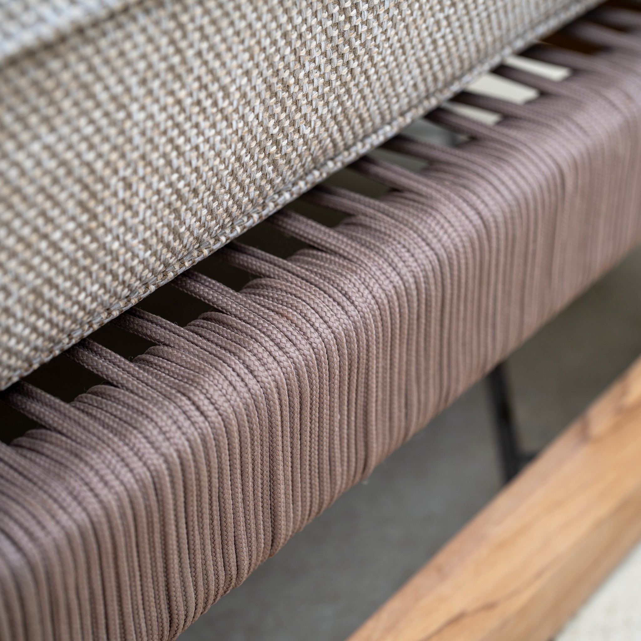 Close-up of woven beige upholstery and tightly wrapped brown cord on teak wood, part of the Tivoli 3 Seat Sofa Set with Marble Coffee Table in Fawn.