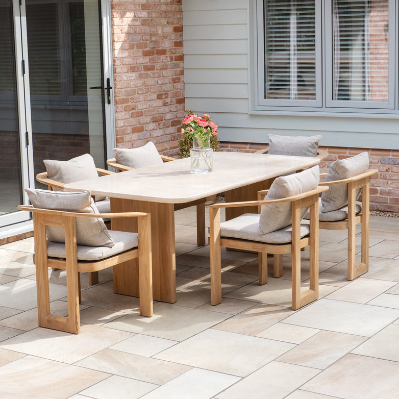The Tivoli 6 Seat Dining Set with Marble Dining Table in Fawn includes a stylish marble table and six cushioned chairs, offering an elegant and comfortable setting for outdoor dining.