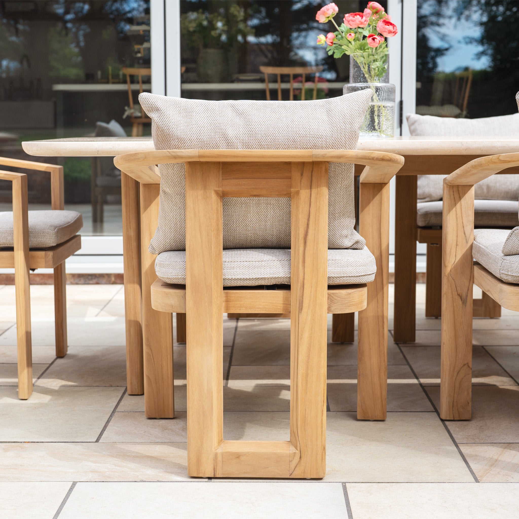 The Tivoli 6 Seat Dining Set features a marble dining table in fawn with comfortable chairs, making it perfect for your tiled patio.