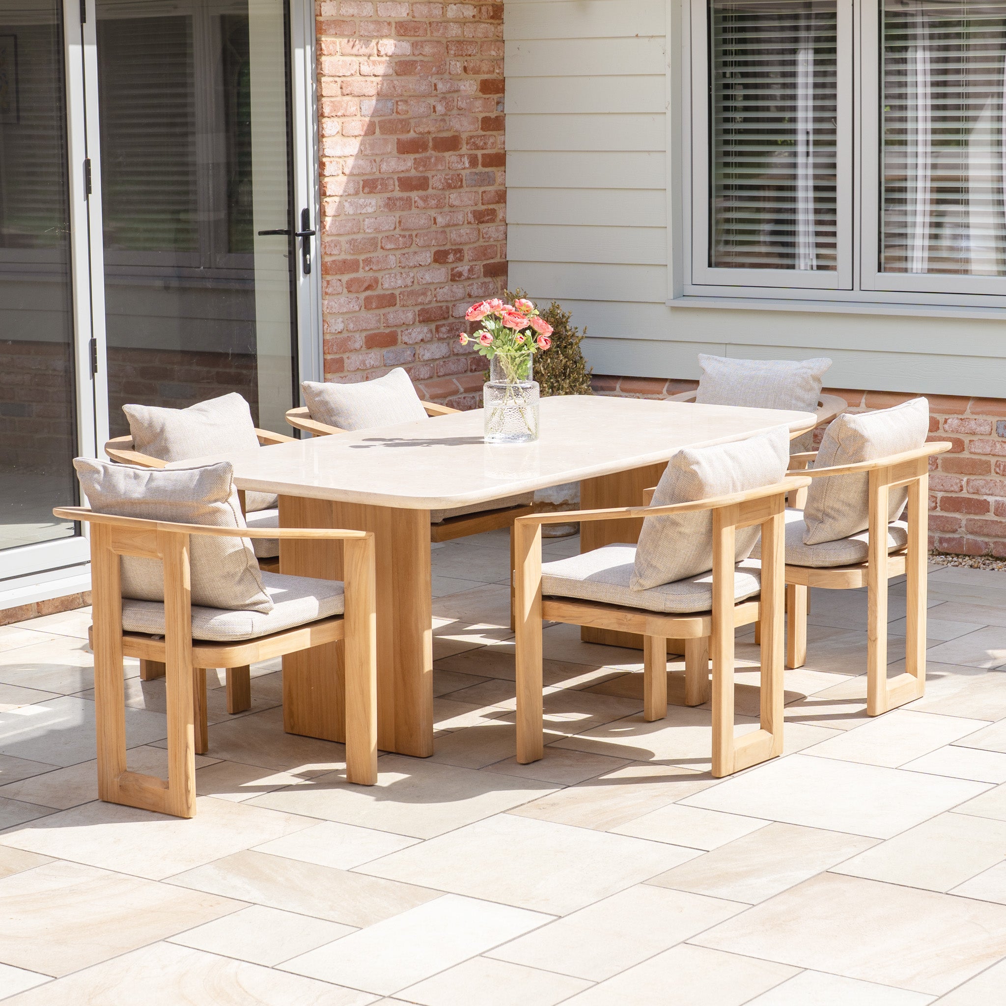 The Tivoli 6 Seat Dining Set with Marble Dining Table in Fawn includes six cushioned chairs, ideal for your patio dining and entertaining needs.