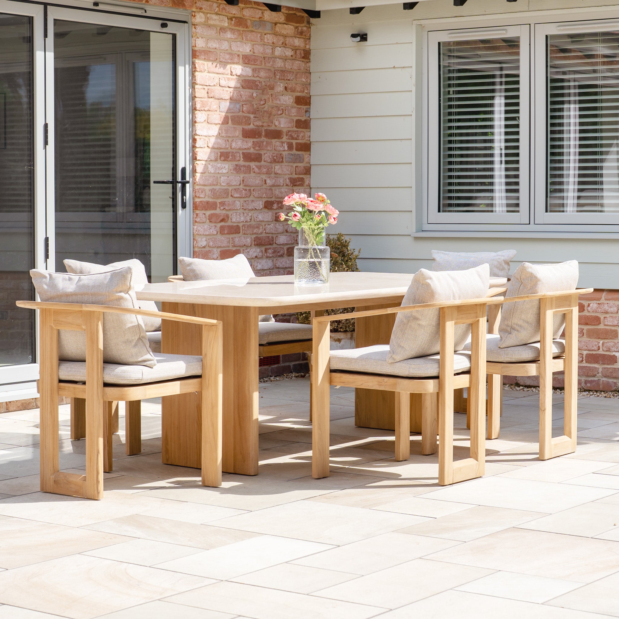 The Tivoli 6 Seat Dining Set with Marble Dining Table in Fawn features six cushioned chairs and a stylish marble tabletop, perfect for outdoor gatherings and seamlessly blending style with comfort.