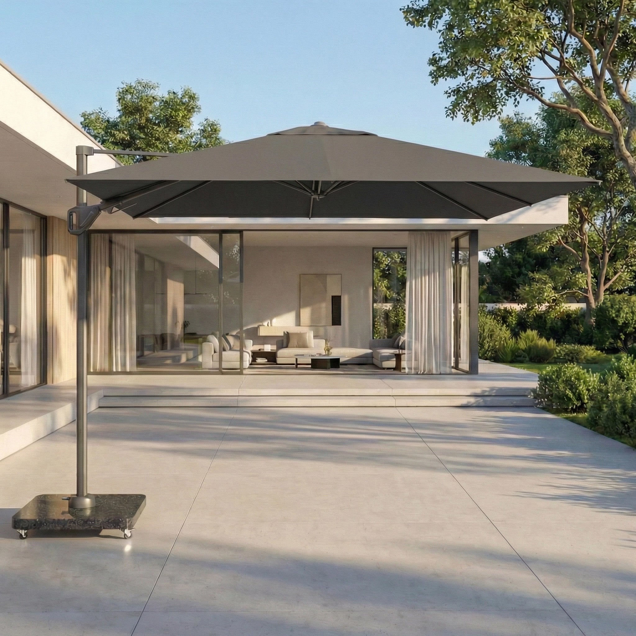 The Pacific Lifestyle Voyager T2 2.7m Square Cantilever Parasol in Anthracite with a 90kg granite base shades a modern patio, while a sleek interior can be seen through the glass doors.