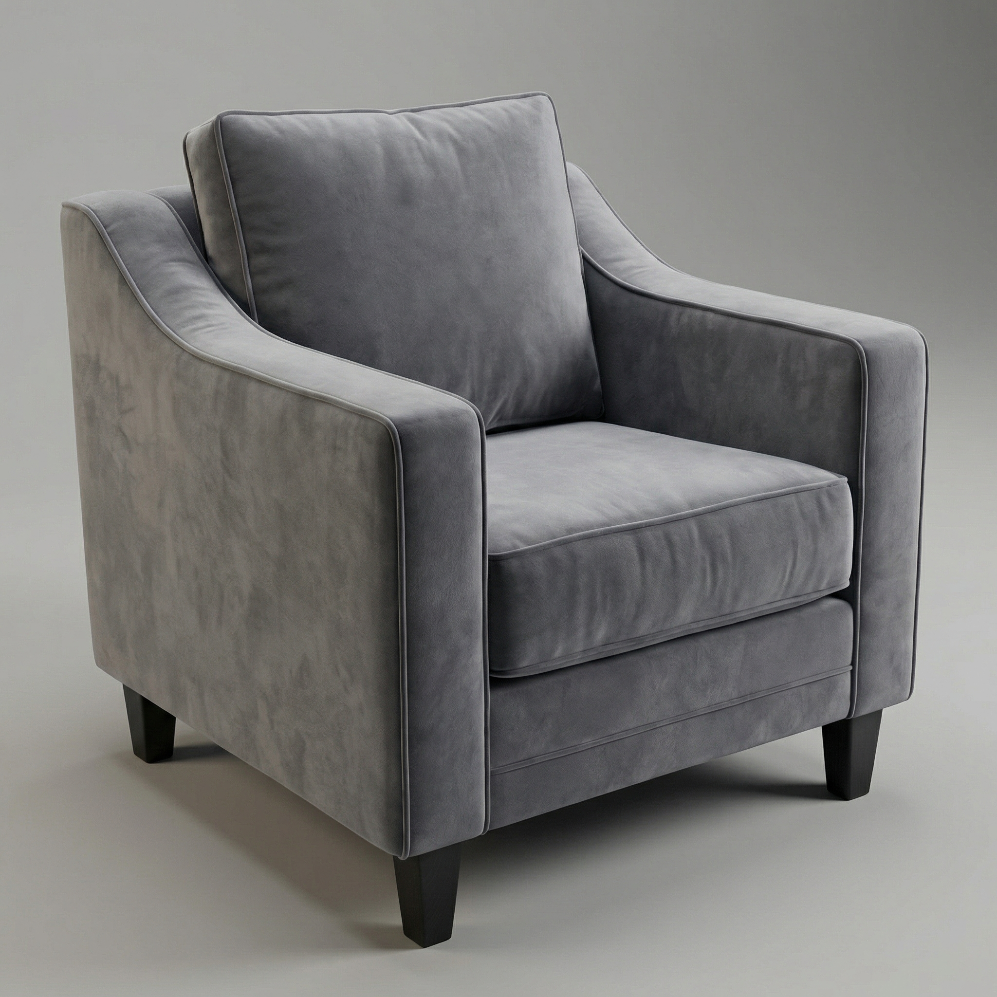 A contemporary Wiltshire Velvet Armchair in Steel Grey features plush cushions and dark wooden legs, placed against a neutral background.