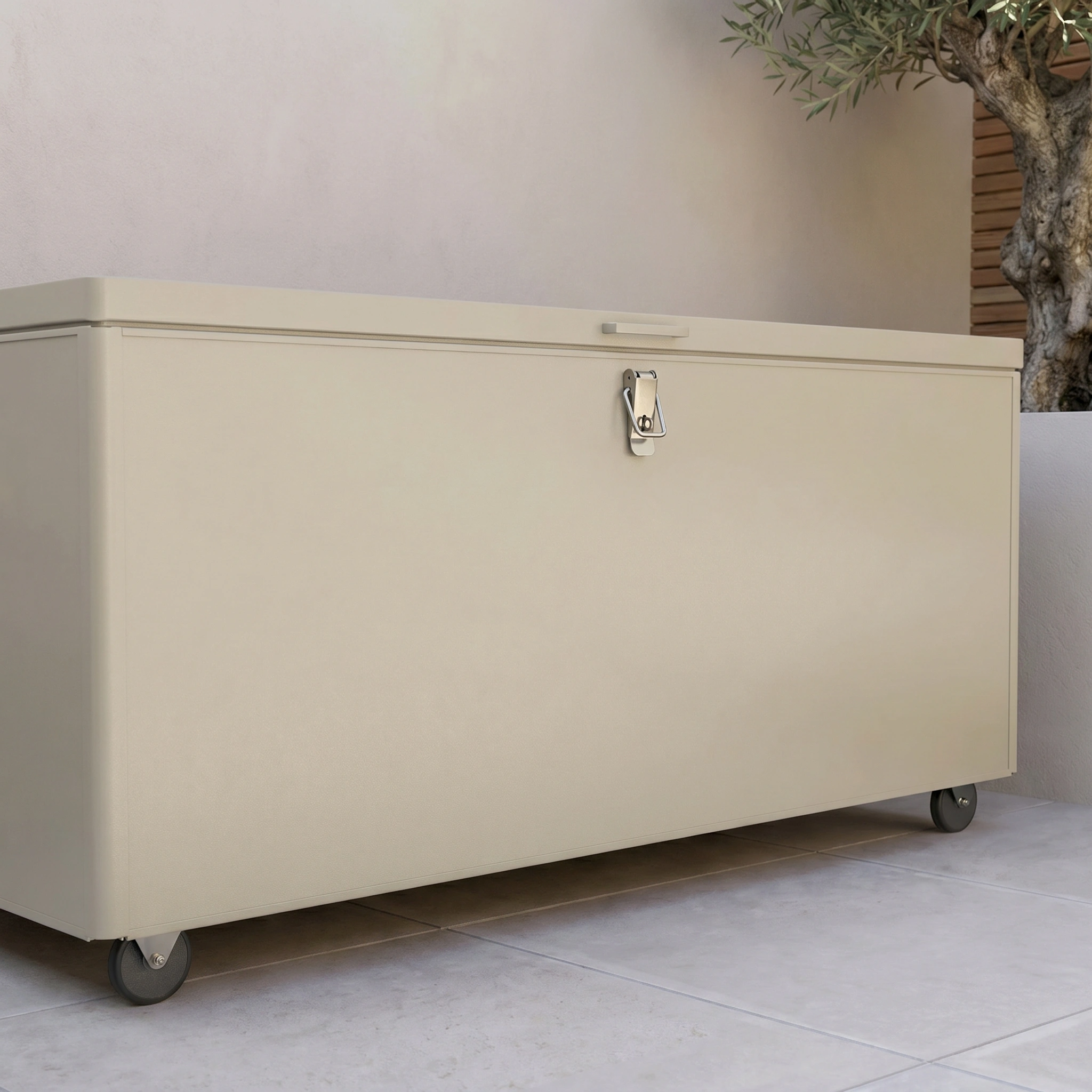 The Large Aluminium Storage Box in Latte, placed on a tiled patio near a potted plant, provides secure and convenient storage with wheels and lockable design for your outdoor space.