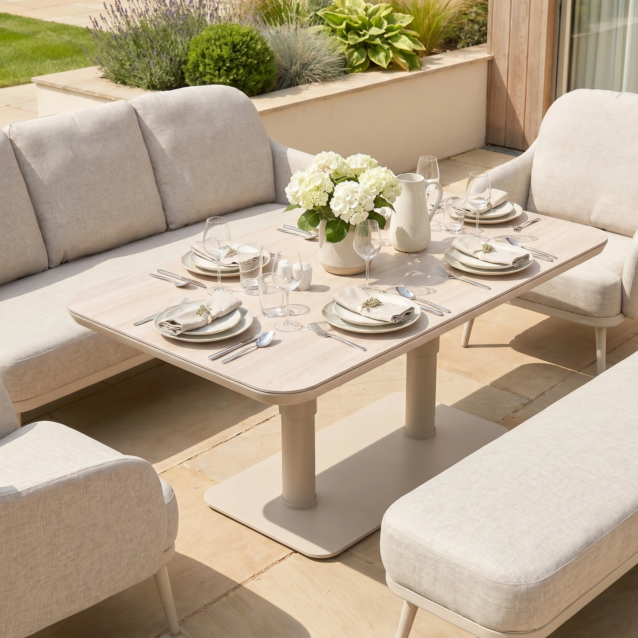 The Alva 3 Seat Sofa Dining Set with Rising Table in Fawn offers stylish outdoor dining comfort—a chic garden furniture set complete with a smart rising table for every occasion.