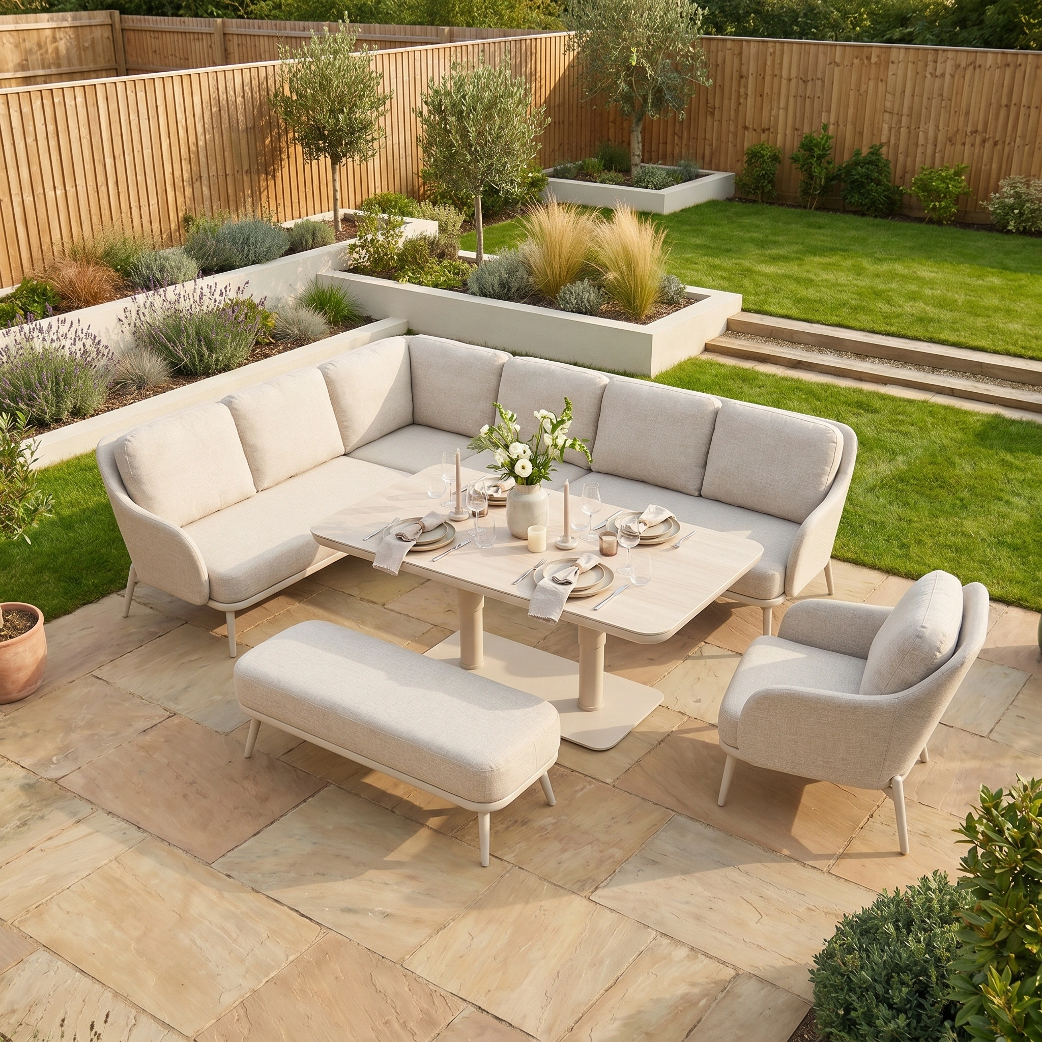 The Alva Corner Dining Set with Rising Table and Armchair in Fawn features light cushions, a modern design, and is perfect for relaxed dining as stylish garden furniture in your sunny backyard.