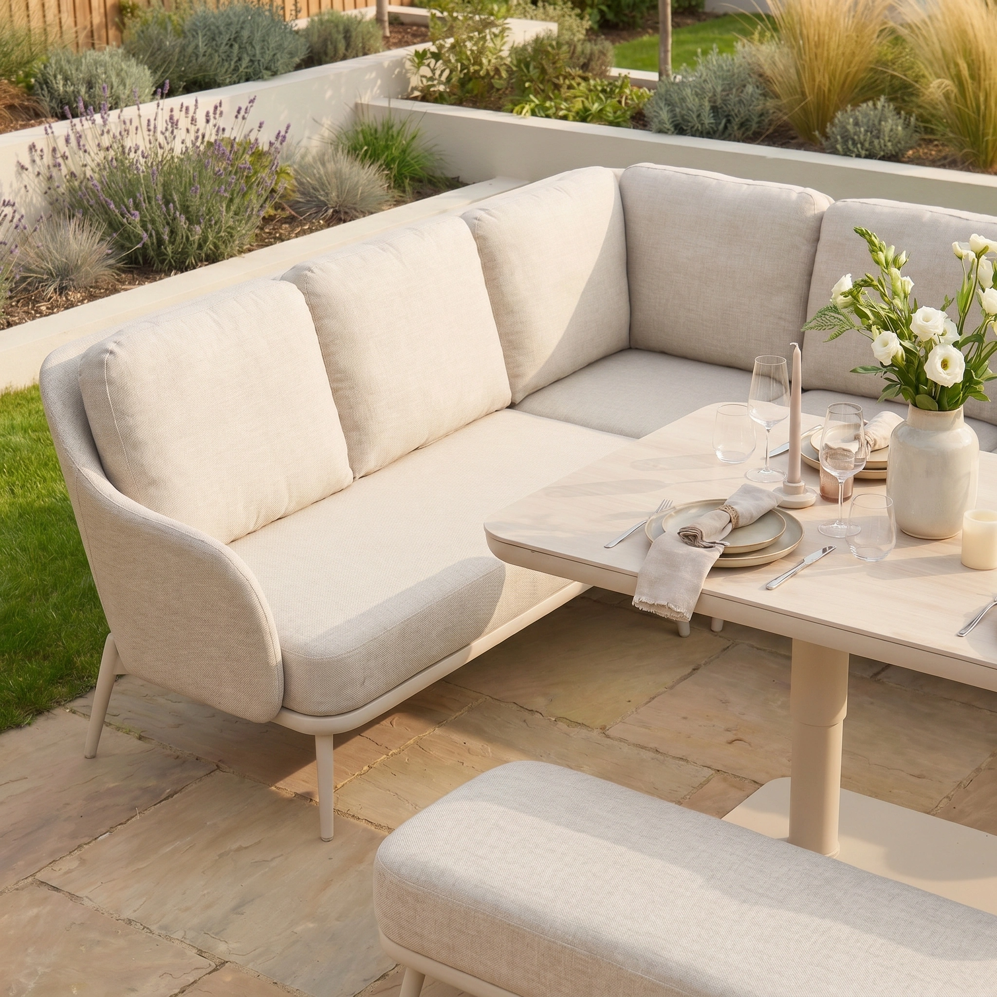 The Alva Corner Dining Set with Rising Table and Armchair in Fawn is ideal garden furniture, featuring a stylish outdoor sofa and bench—perfect for relaxing or dining on your landscaped patio.