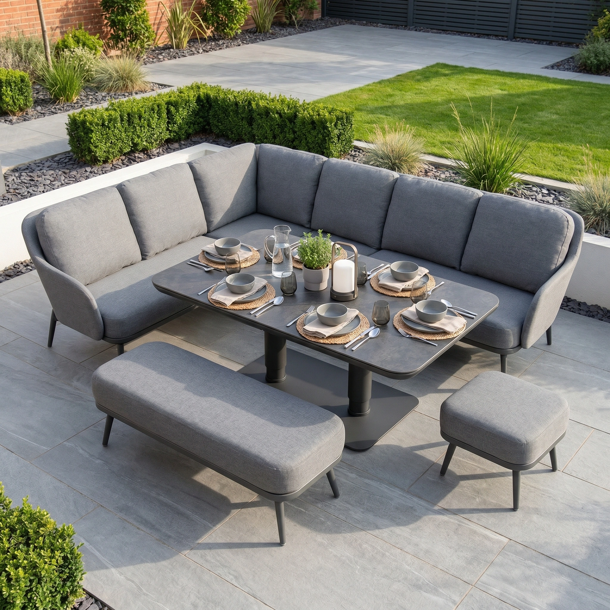 The Alva Corner Dining Set with Rising Table in Grey features seating for six with a bench and stool—perfect garden furniture for stylish tiled terraces.