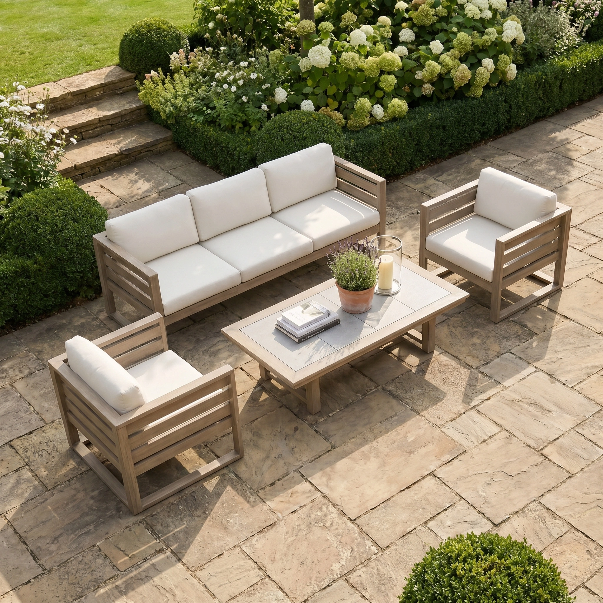 The Andora 3 Seat Sofa Set with 2 in 1 Table in Weathered Brown is perfect modular outdoor furniture for relaxing in style, featuring a sofa and table—ideal for your patio surrounded by greenery.
