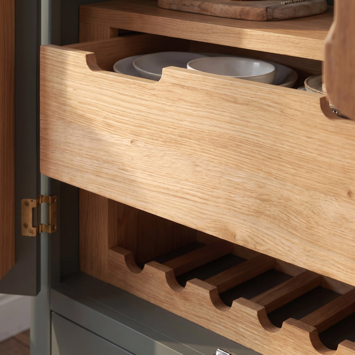 a wooden cabinet with a drawer and a plate in it