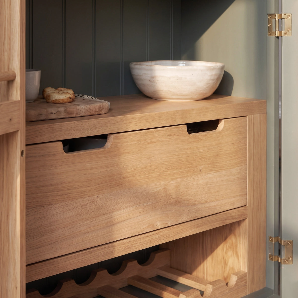 a wooden cabinet with a bowl on top