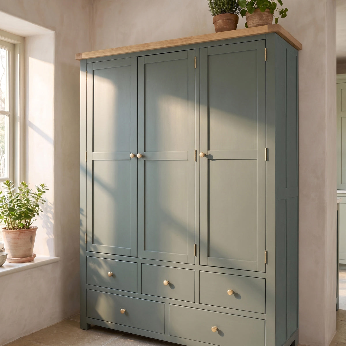 a large cabinet with plants on top