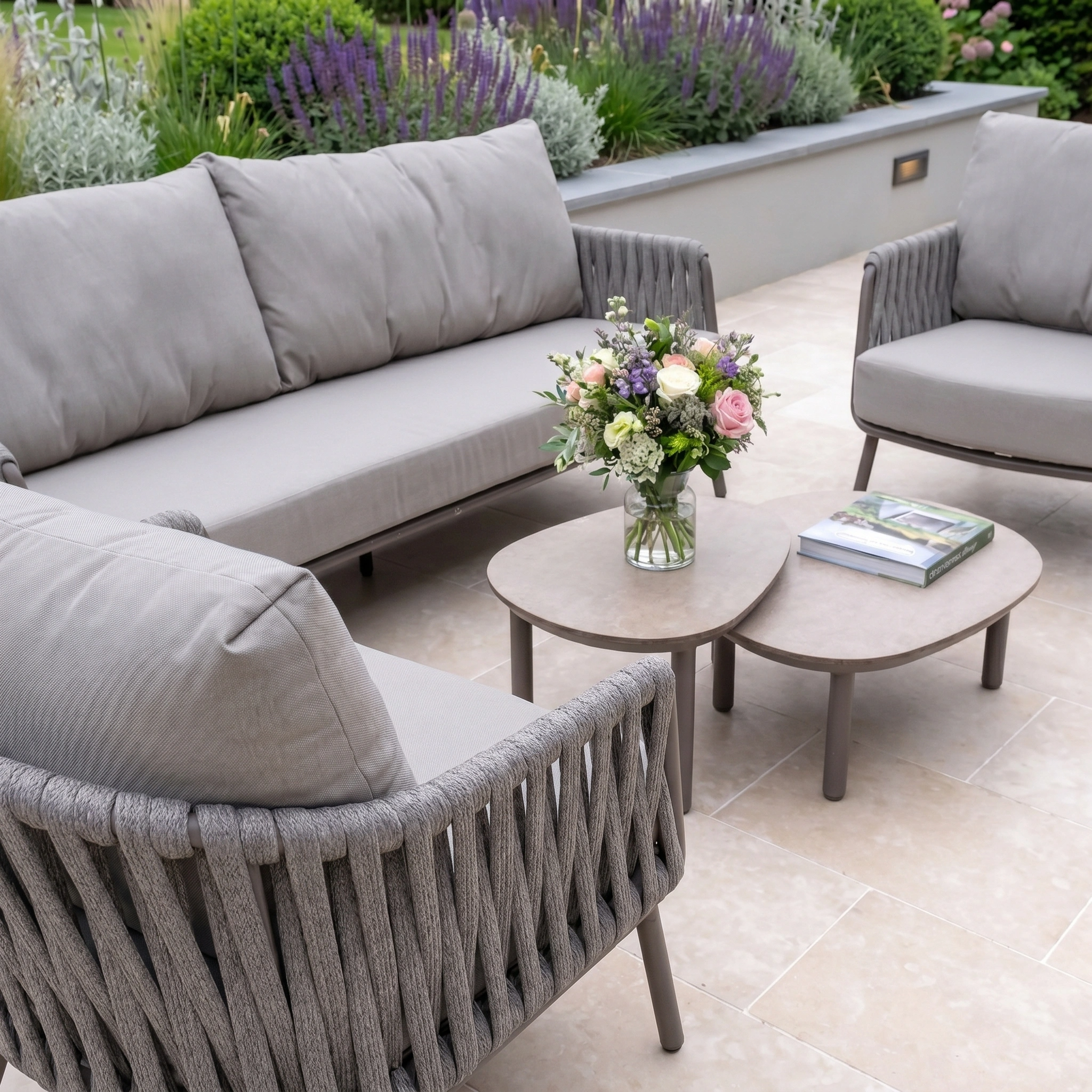 The Capri 3 Seat Sofa Set in Stone Grey offers comfy cushioned chairs, a cozy sofa, and a compact coffee table—ideal for stylish outdoor or garden settings.