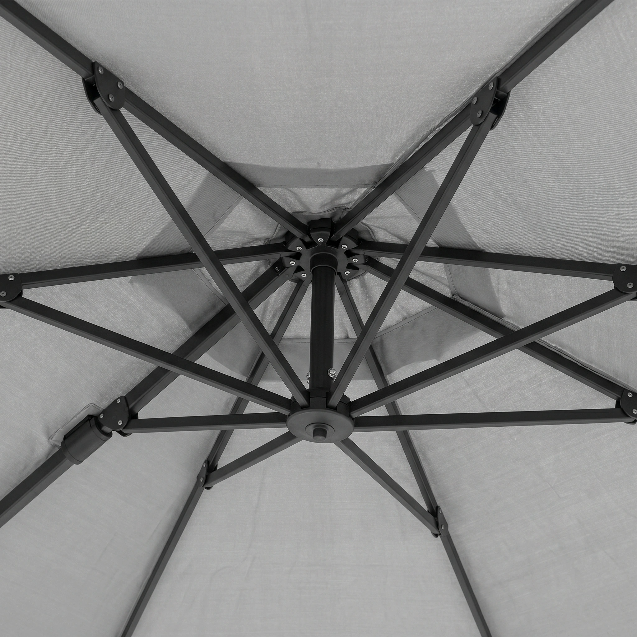 Close-up view of the underside of the Challenger T2 3.5m x 2.6m Rectangular Cantilever Parasol in Grey with 90kg Granite Base, showing its powder-coated aluminium support ribs and central hub.