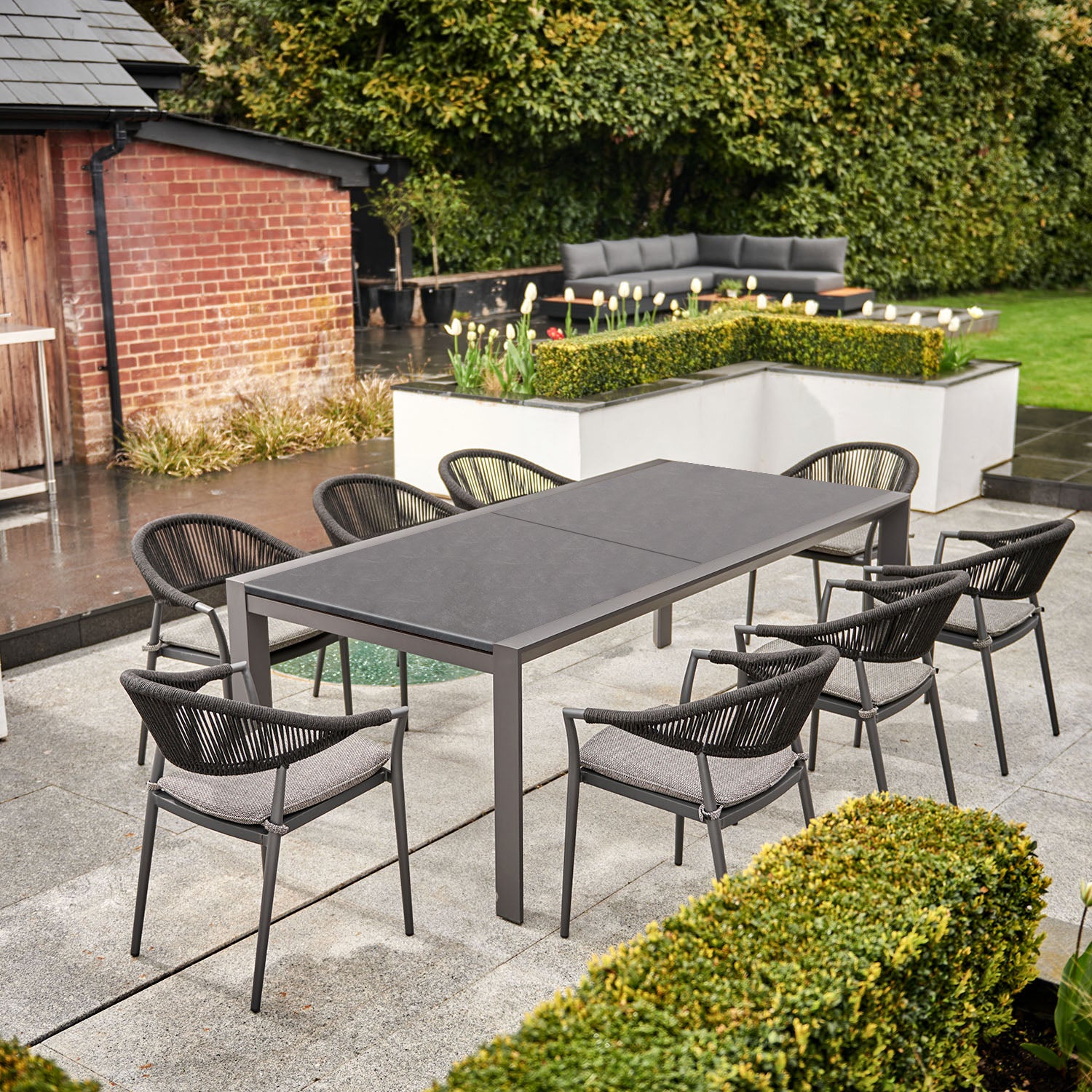 Cloverly 10 Seat Rectangular Extending Dining Set with Ceramic Table in Charcoal
