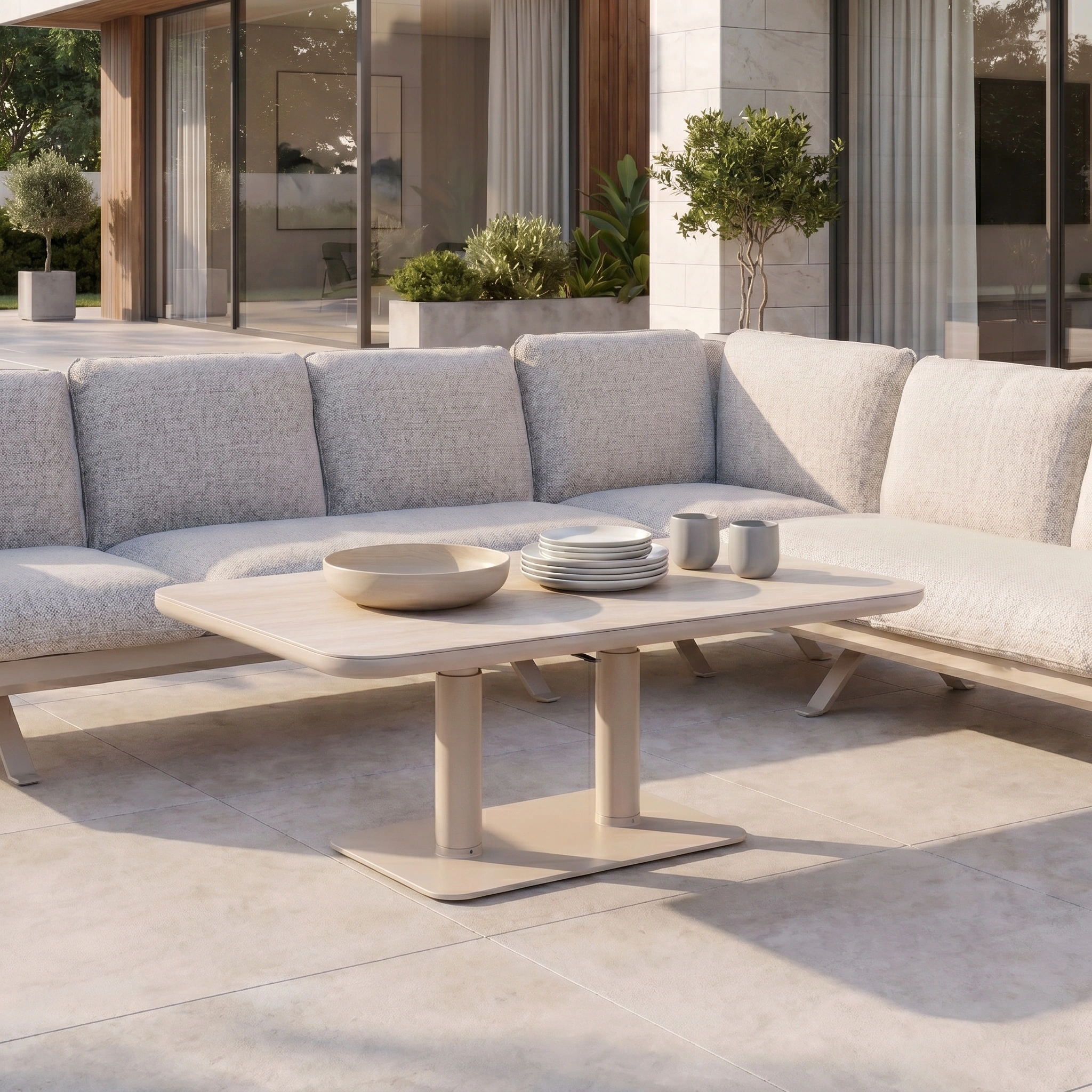 Modern outdoor patio featuring the Como Corner Sofa Set with Altura Rising Table in Oatmeal, creating a luxury vibe with stylish aluminium detailing, completed with plates and mugs on the table.