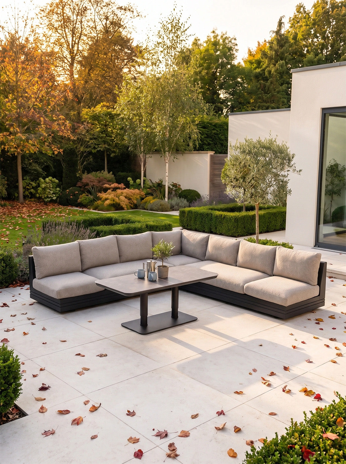 a couch and table outside of a house