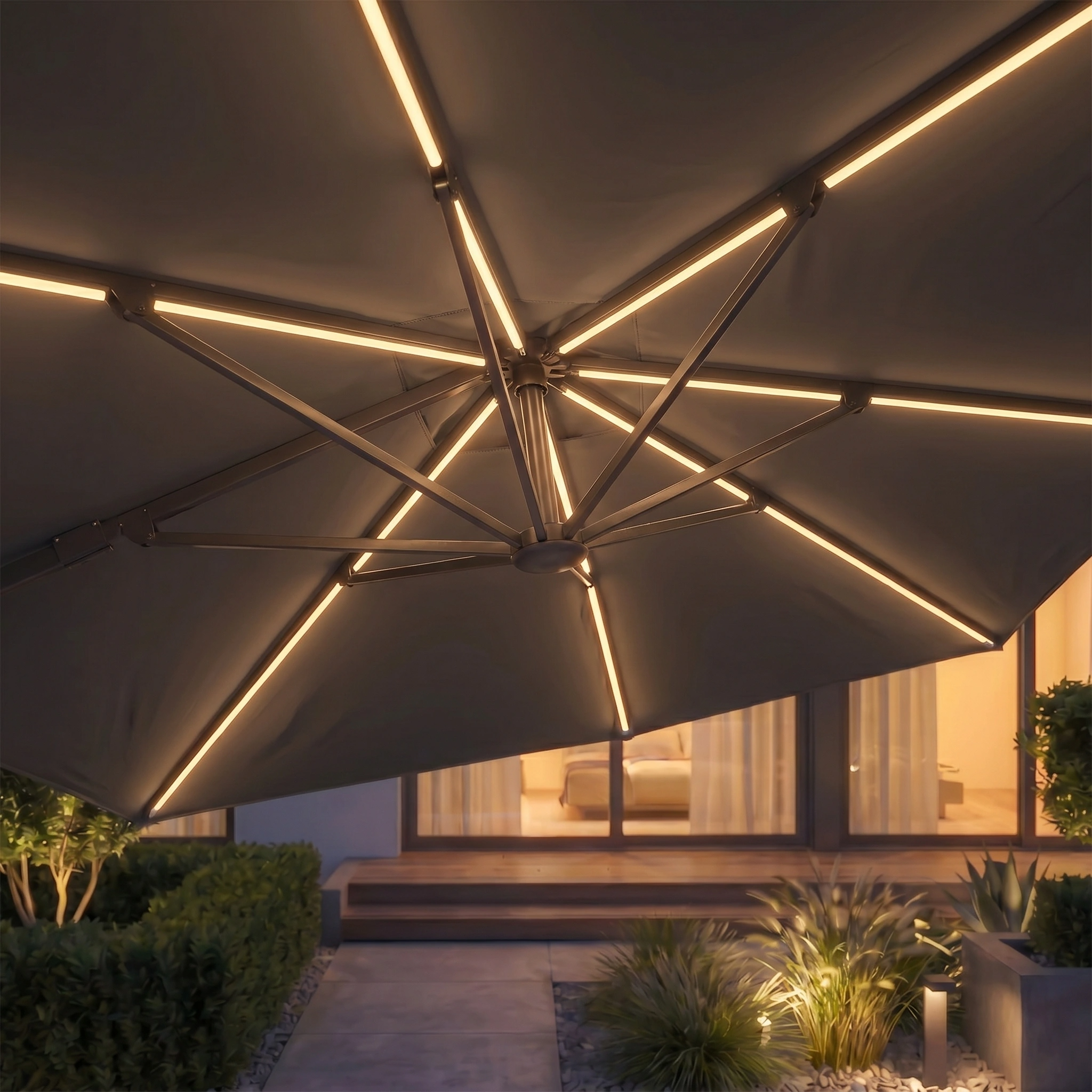 The Glow Challenger T2 3m Square Cantilever Parasol in Anthracite features built-in LED lights, illuminating your modern patio at dusk for a stylish and inviting outdoor atmosphere.