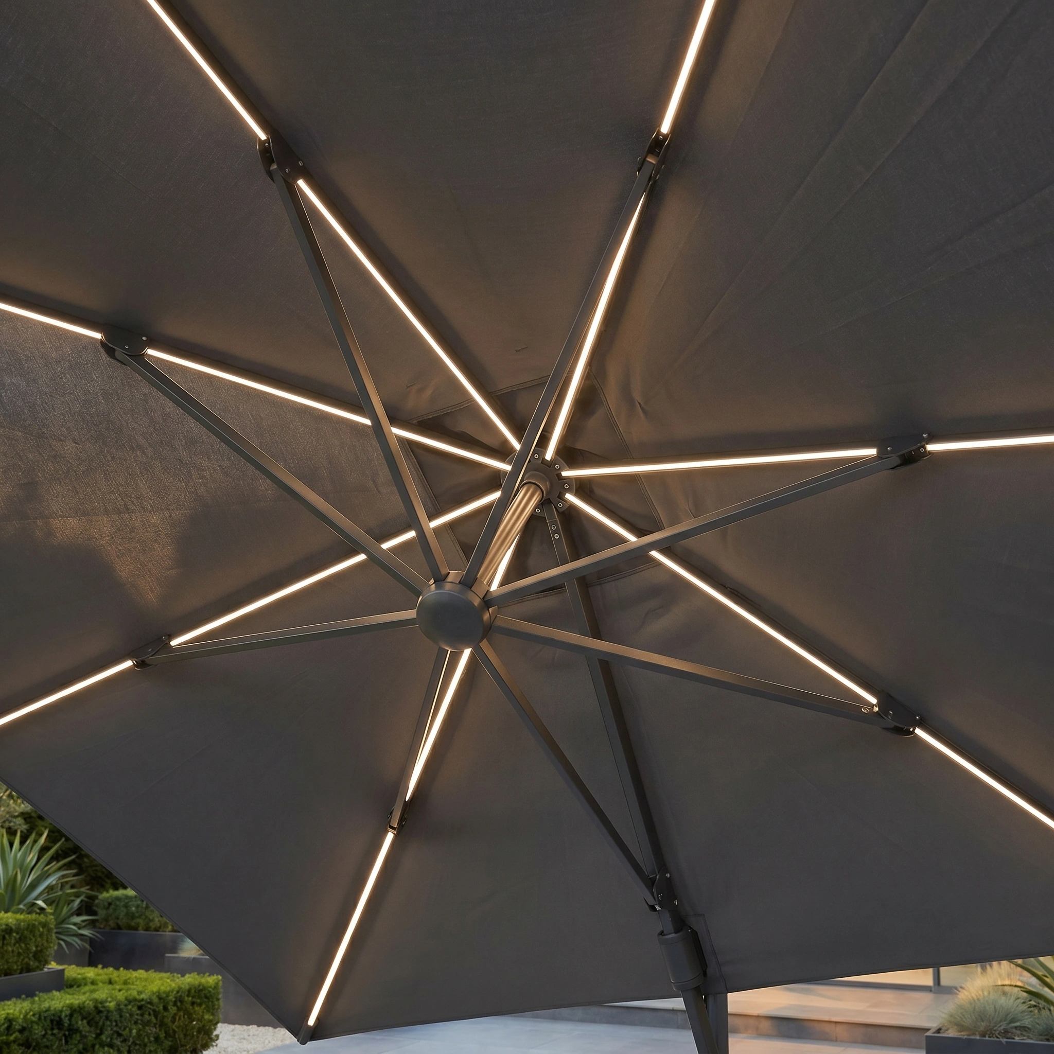 Close-up of the Glow Challenger T2 3m Square Cantilever Parasol in Anthracite, featuring built-in LED lights along the ribs—ideal for evening gatherings.