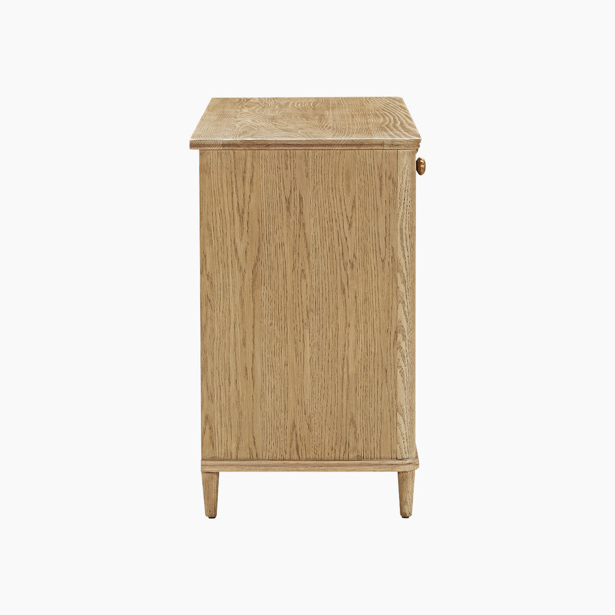 Side view of the Hadley Herringbone 3 Door Sideboard in Natural, featuring a light wood finish, flat top, four barrel legs, and small round knobs on the right.