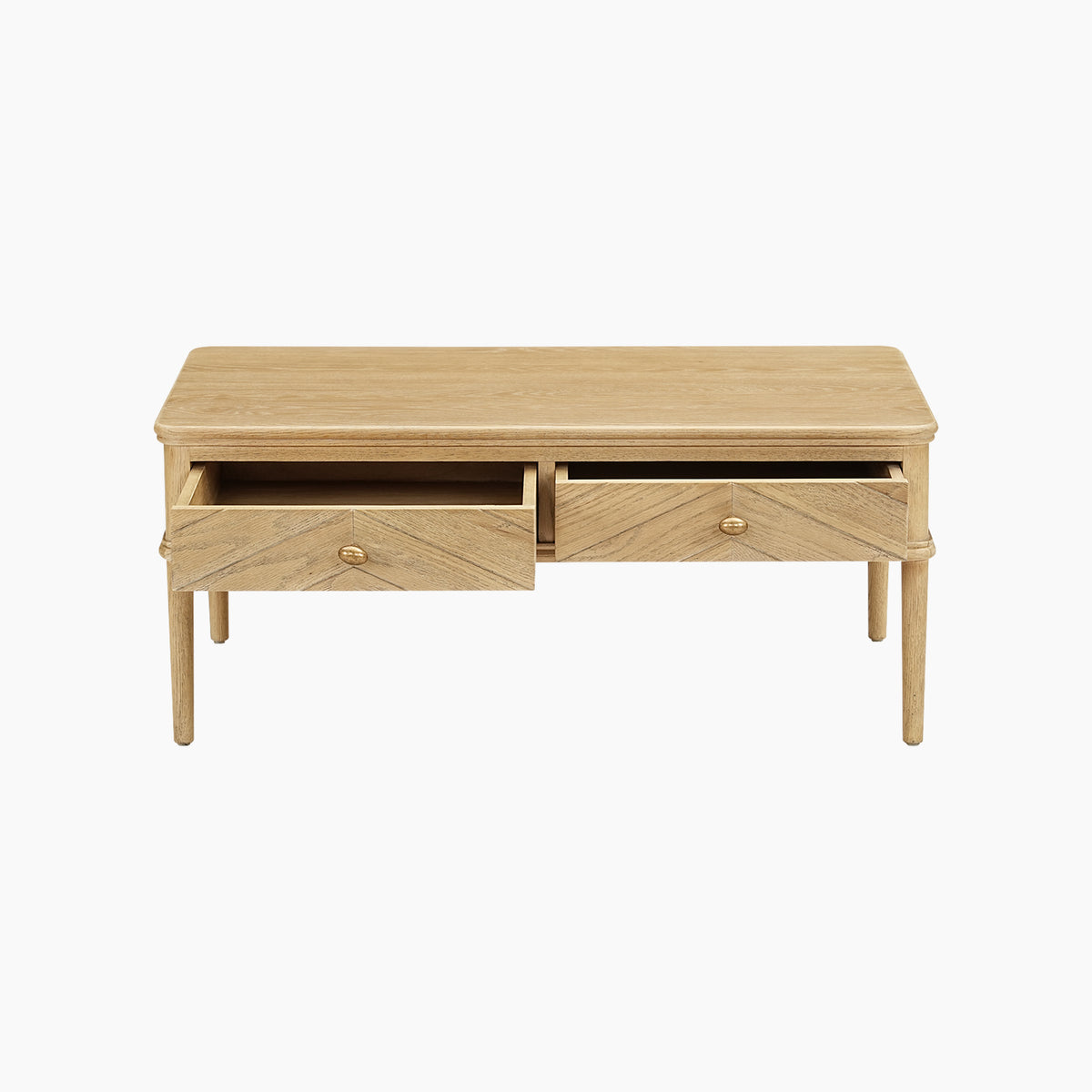 The Hadley Herringbone Coffee Table in Natural is a light wood oak coffee table with two drawers—one open and one closed—set against a white background, and showcases a distinctive chevron parquet tabletop design for added elegance.