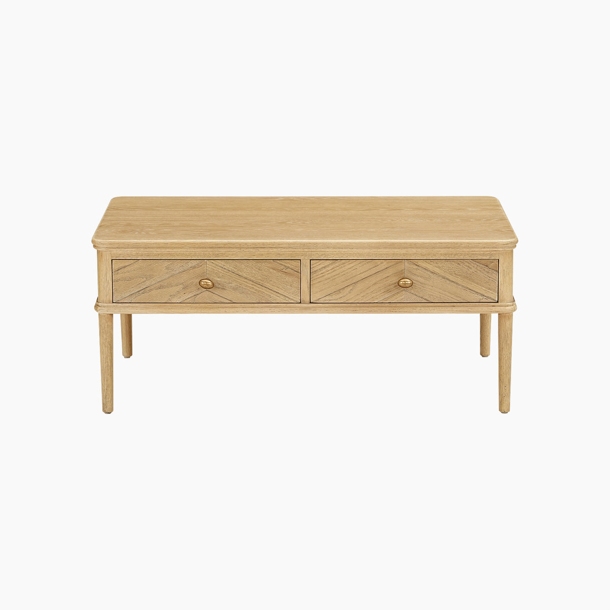The Hadley Herringbone Coffee Table in Natural features a light oak rectangular design with two front drawers, each adorned with round handles, and is set against a white background. Its striking chevron parquet detail adds contemporary style to any modern living space.