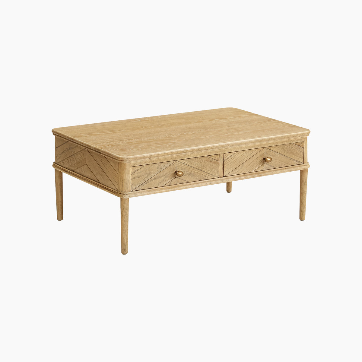 The Hadley Herringbone Coffee Table in Natural features light wood construction, two front drawers, and a chevron pattern on the sides, reminiscent of a natural oak coffee table, shown against a white background.