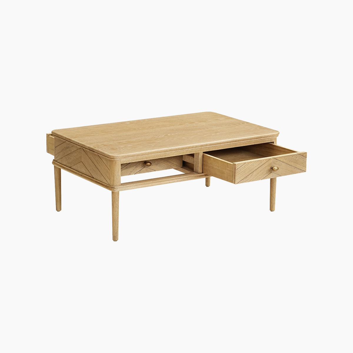 Hadley Herringbone Coffee Table in Natural with a light wood finish, featuring a smooth rectangular top with a subtle chevron parquet design, two open drawers, and four barrel legs.