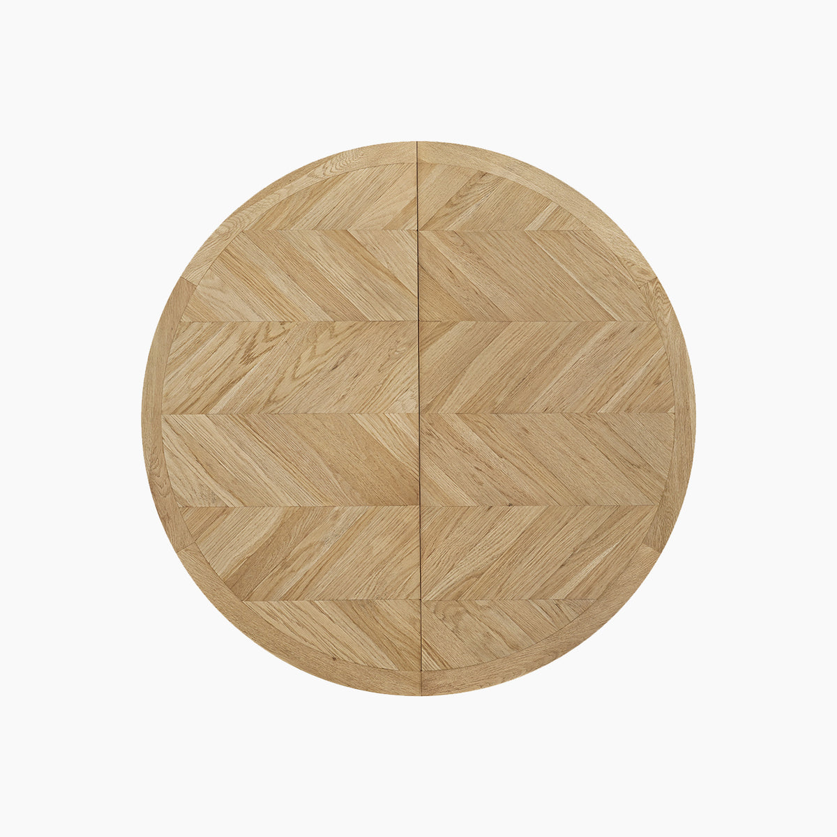 Round oak dining table with a striking chevron pattern, shown from above against a plain white background. This is the Hadley Herringbone 4-6 Round Extending Dining Table in Natural, expertly designed to provide both style and versatility for modern dining spaces.