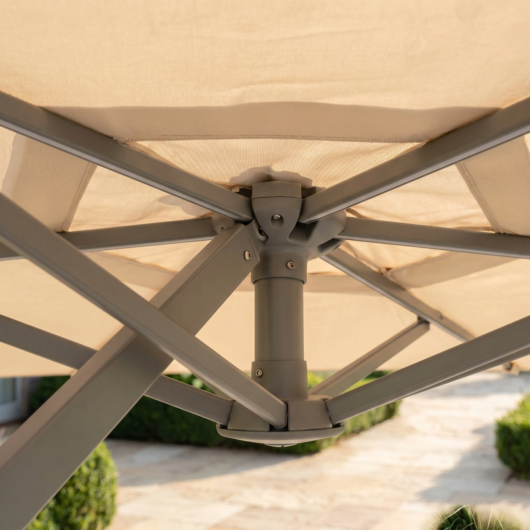 Close-up of the sturdy metal frame and support structure under the Hera 2.7m Square Cantilever Parasol with LED Lighting in Beige, featuring UV50+ protection for outdoor comfort.
