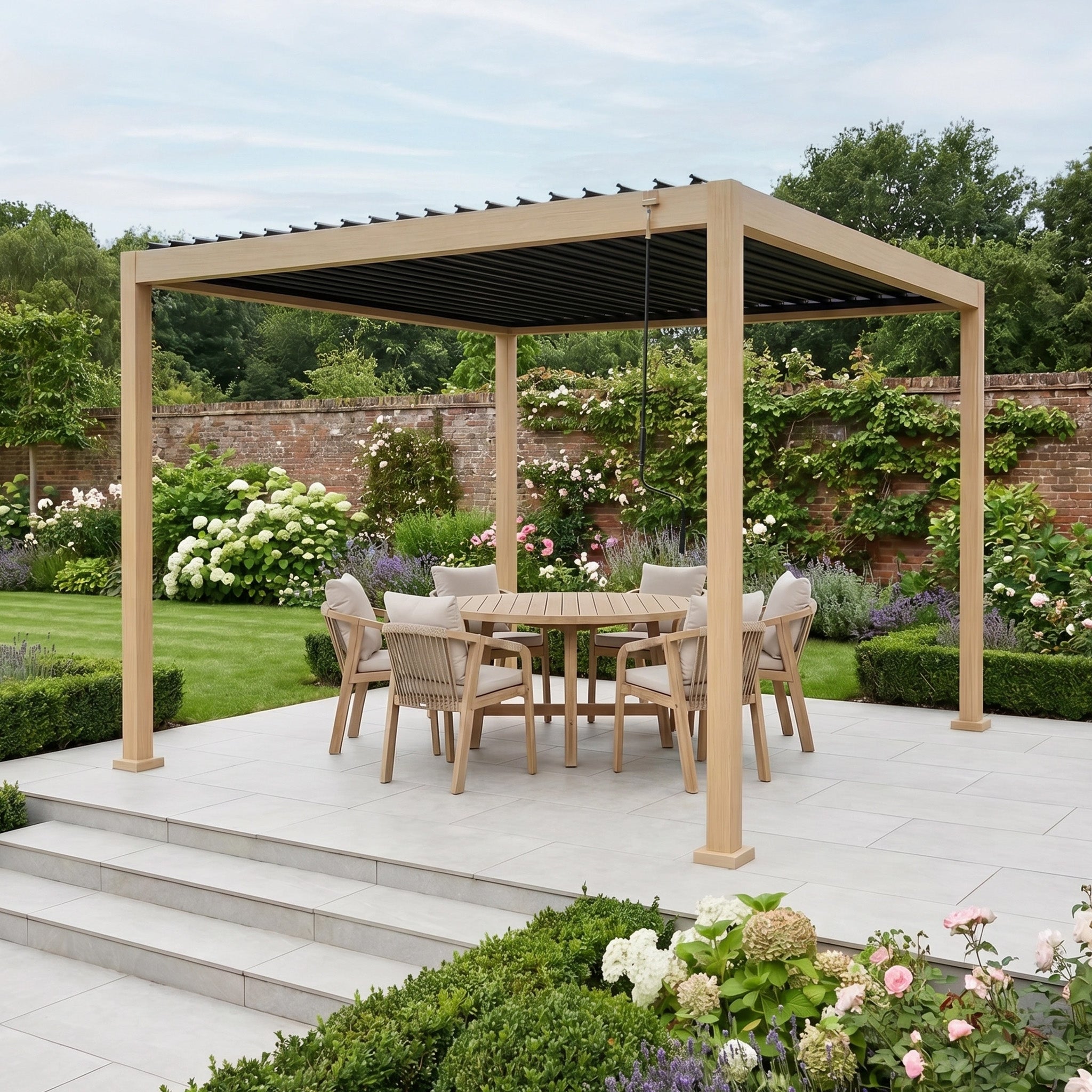 The patio features a PergoSTET Lite Neo 3m x 3m Metal Square Pergola in Wood Effect with tilting steel louvres, sheltering a dining set and surrounded by a lush, landscaped garden.