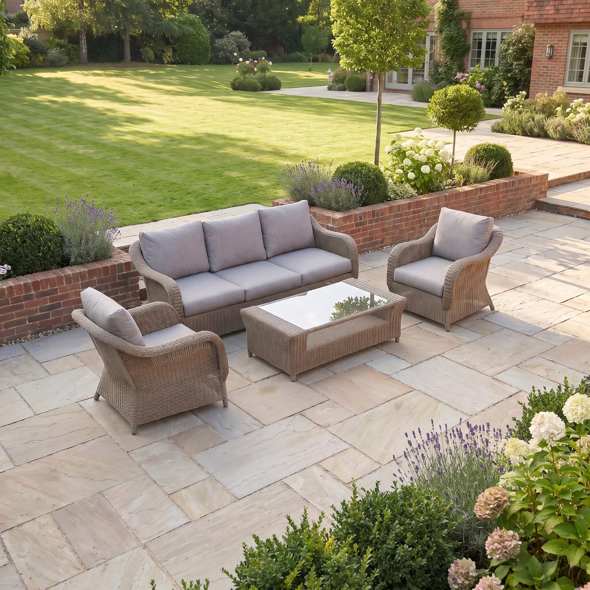 a patio with a couch and chairs