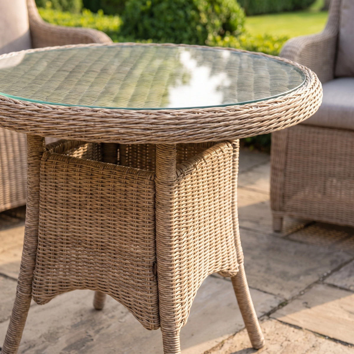 a wicker table and chairs on a patio