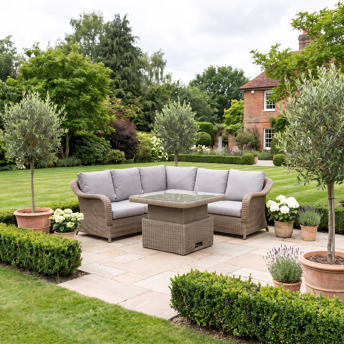 a patio with a table and chairs in a yard