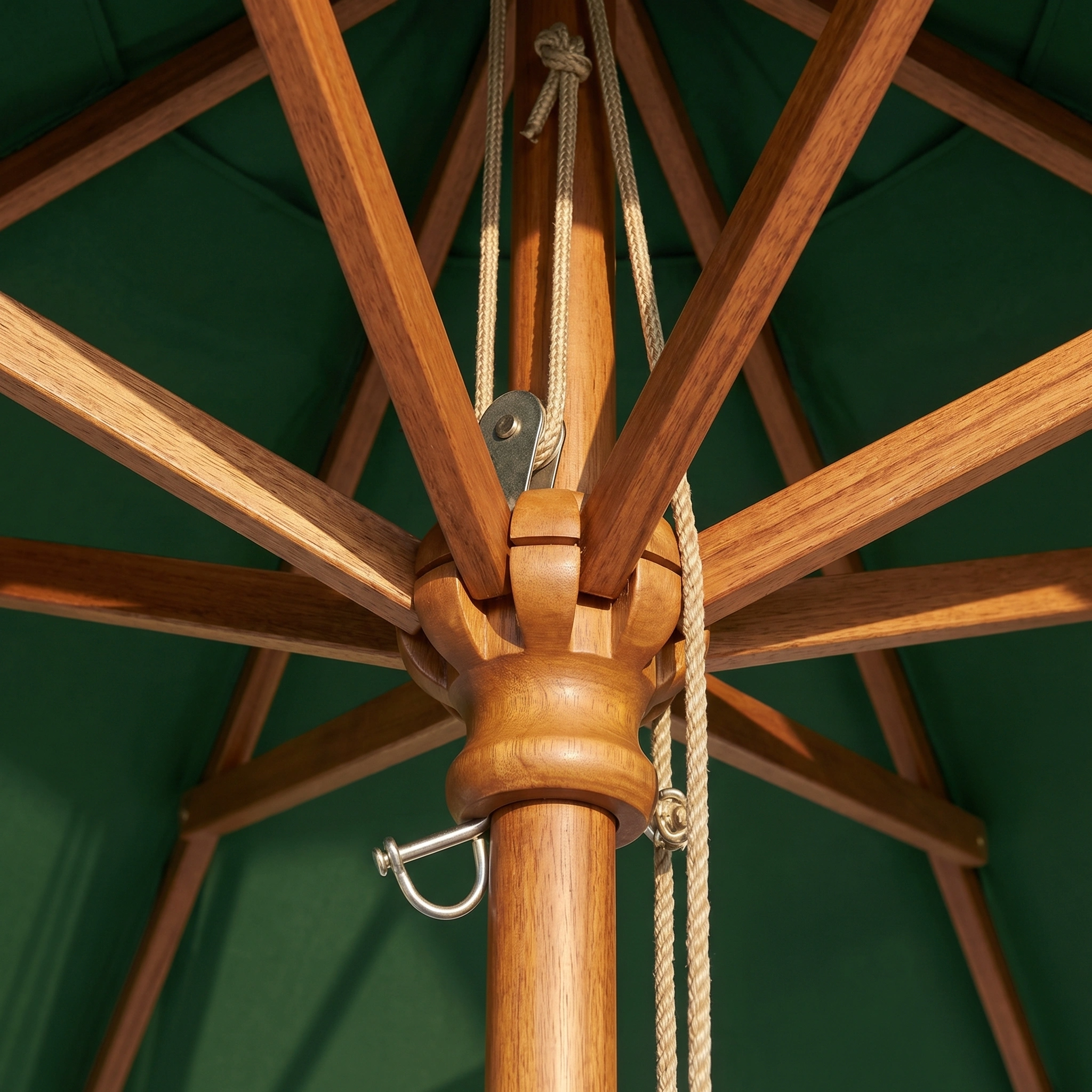 Close-up of the wooden support structure and ropes beneath the Kratos 2.5m Round Wooden Parasol in Green, showcasing its sturdy build.