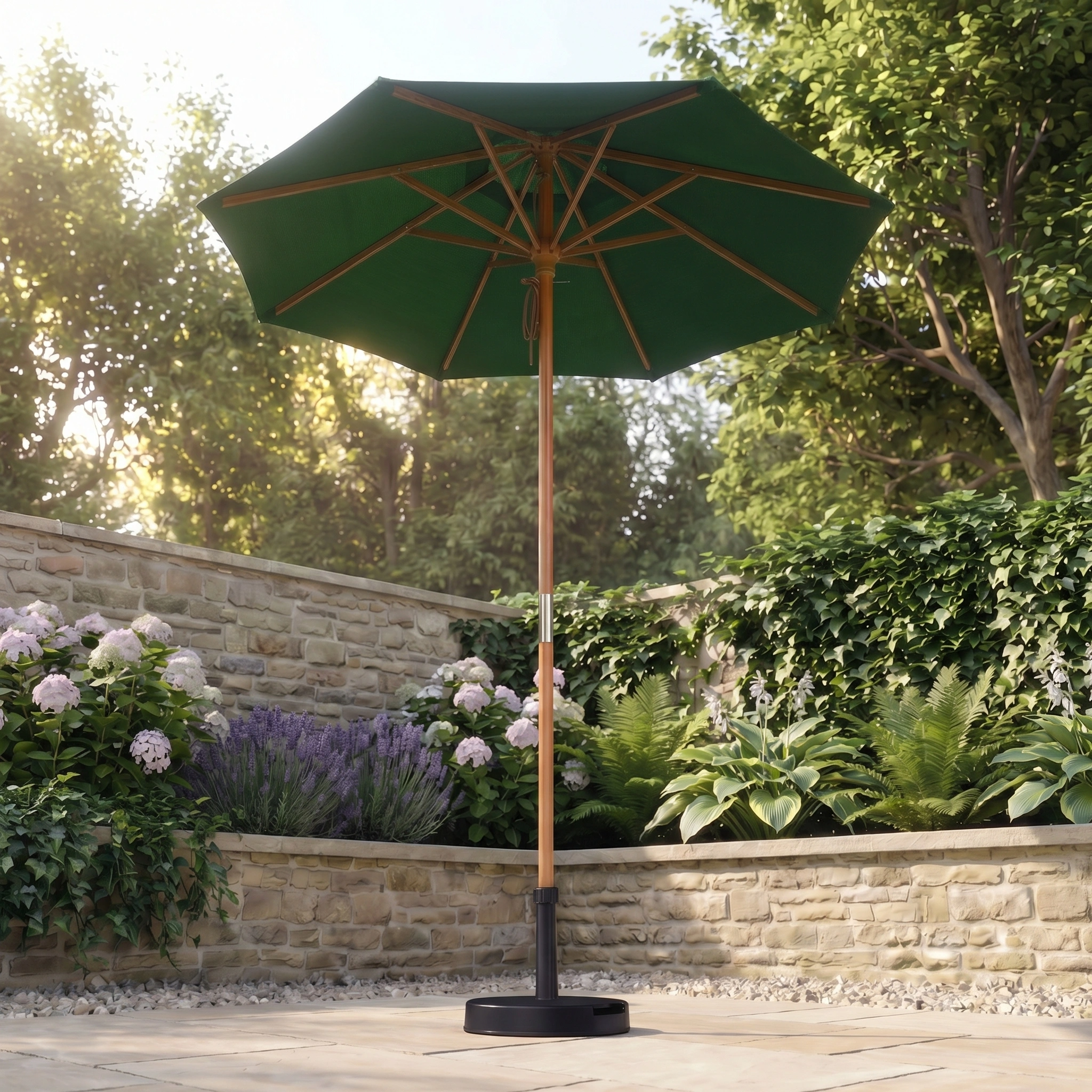 Transform your patio into a serene retreat with the Kratos 2m Round Wooden Parasol in Green, elegantly standing on stone and surrounded by lush plants. Enjoy shade and style in your outdoor space with this sophisticated parasol.