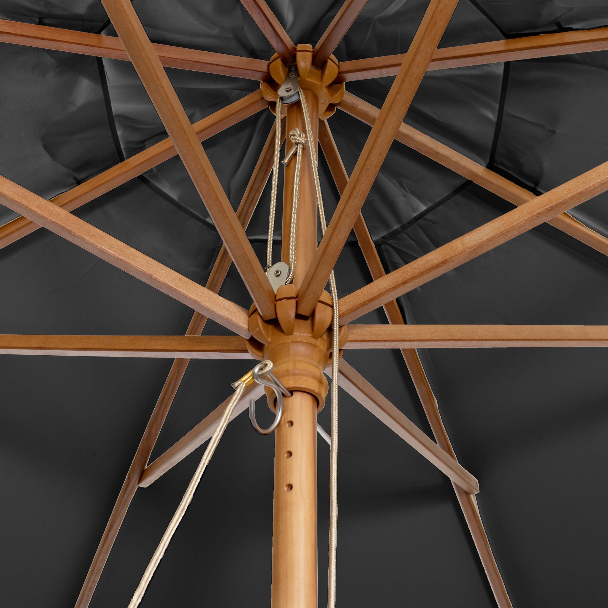 View from beneath the Kratos 2m Round Wooden Parasol in Grey, featuring wooden ribs, pole, a pulley system, and dark canopy fabric—stylish sun protection with UV 50+ rating.