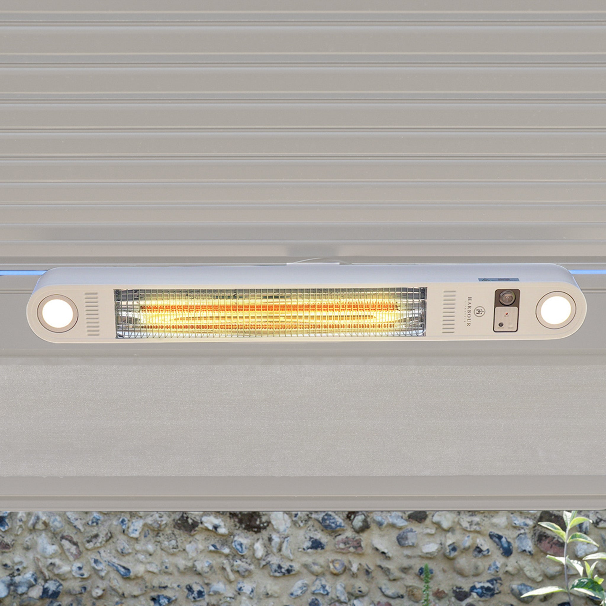The FREE PergoSTET Wifi & Bluetooth Heater in Latte, with dual circular lights, is perfect for cozy, comfortable evenings outdoors—ideal as a wall-mounted pergola ceiling heater under a metallic awning.