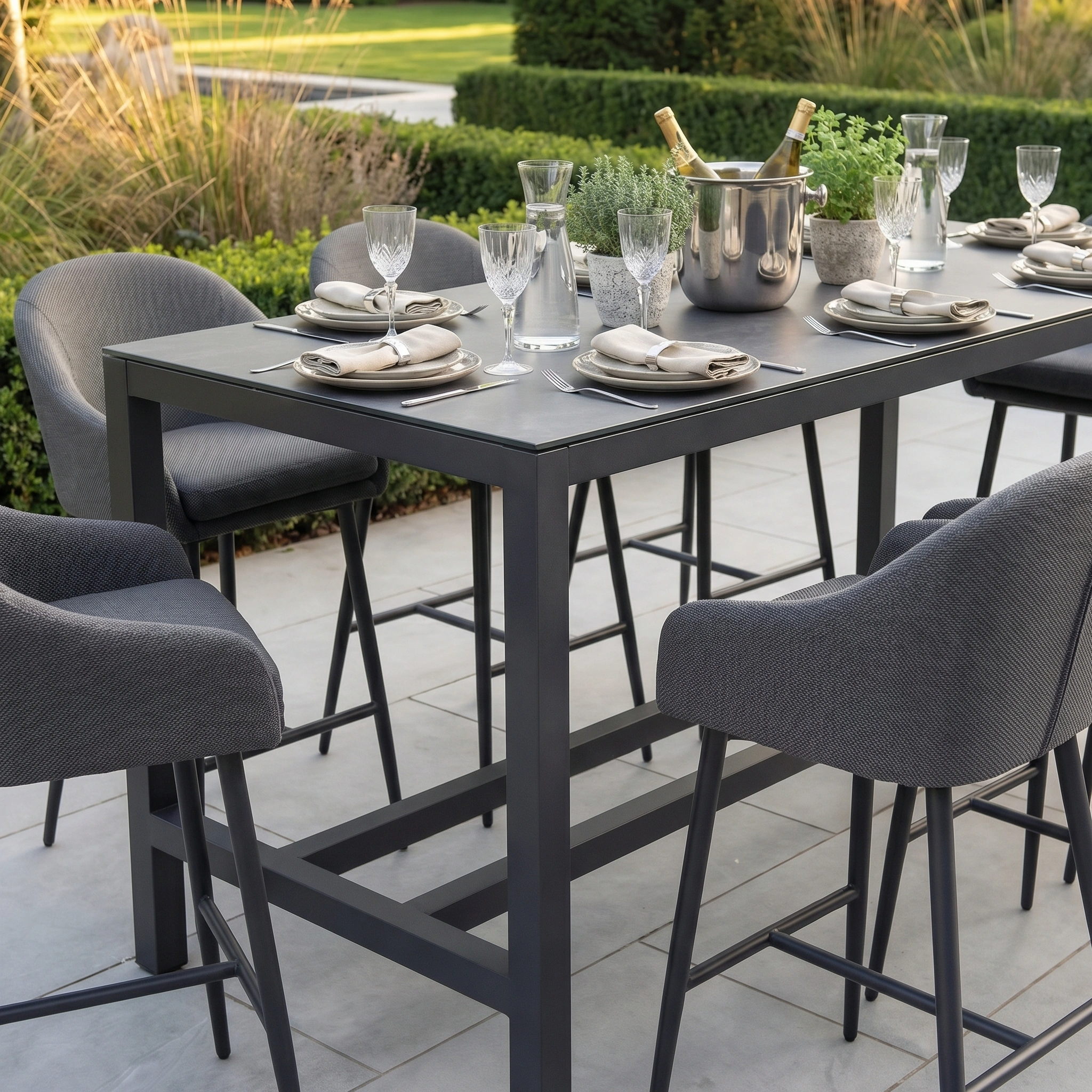 The Luna 8 Seat Bar Set in Grey features modern, all-weather chairs and is perfect for stylish, stain-resistant gatherings on your patio or garden.