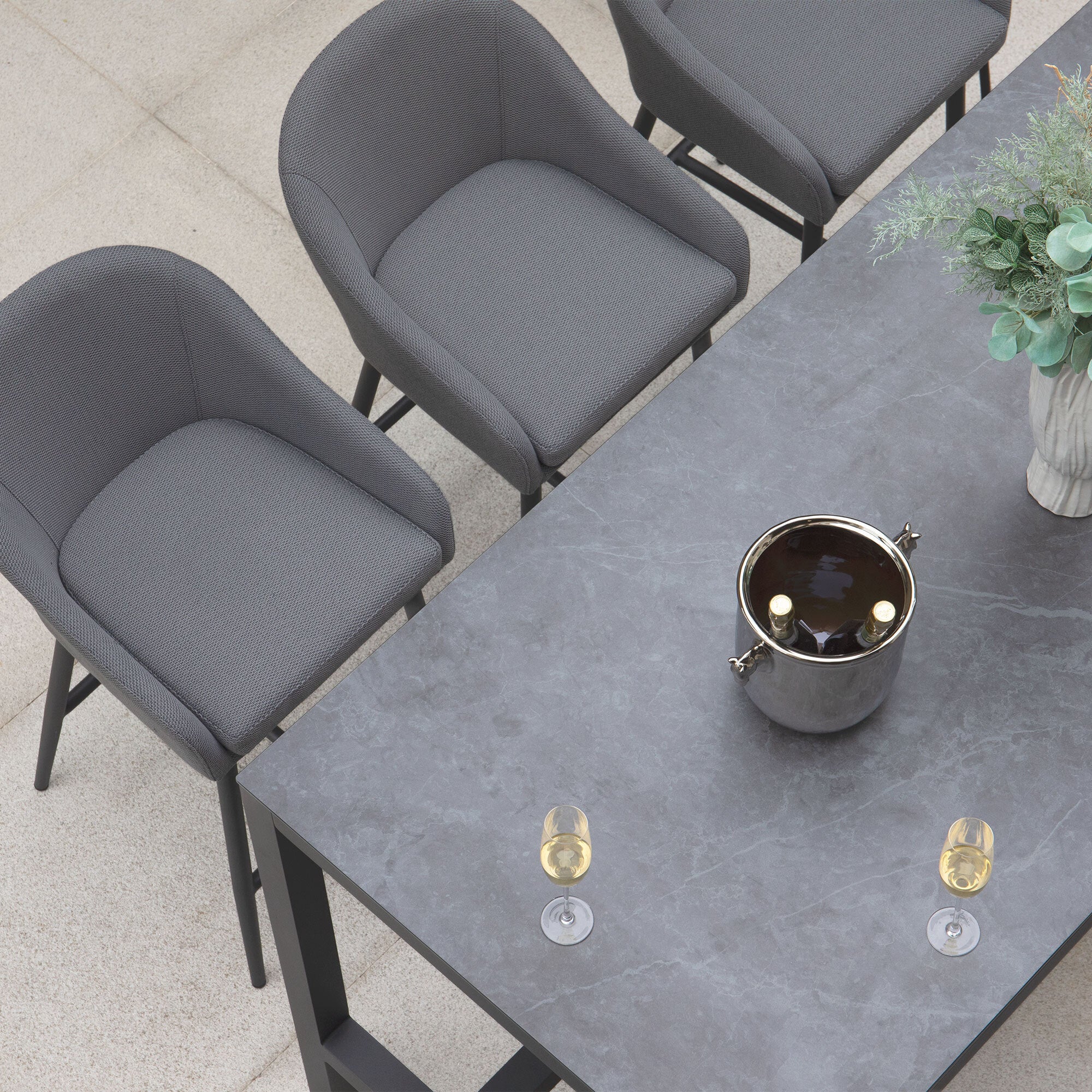 The Luna Outdoor Fabric Bar Stool in Grey (Ex Display) features solution-dyed acrylic fabric—ideal for stylish outdoor gatherings.