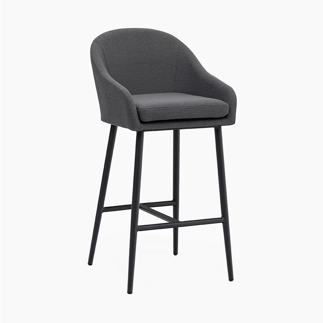 The Luna Outdoor Fabric Bar Stool in Grey (Ex Display) features a dark gray upholstered seat, curved backrest, black metal legs, quick dry foam, and durable outdoor fabric, shown on a white background.