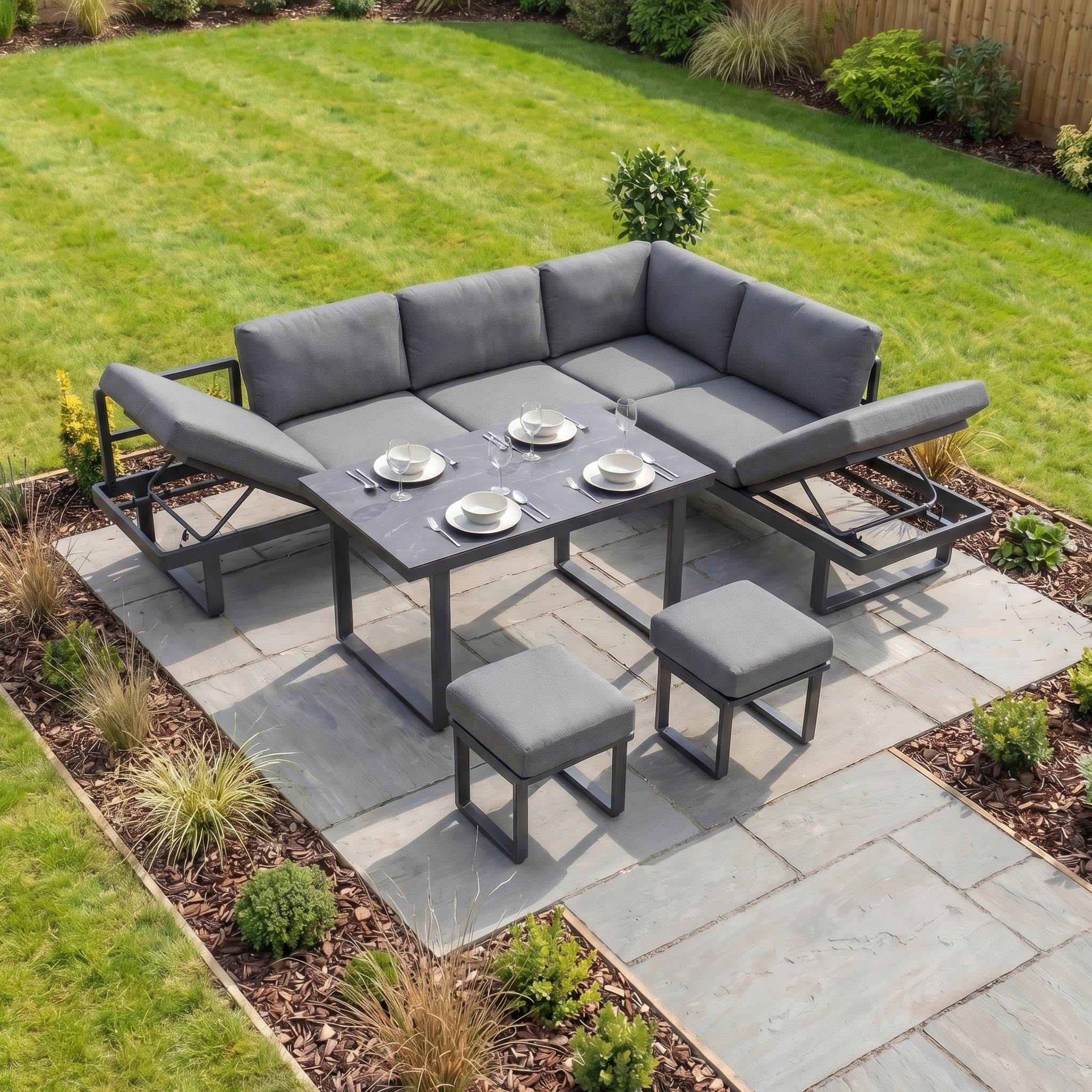 Lyra Corner Dining Set in Charcoal features cushioned seats, table, and stools with a sturdy aluminium frame—stylish outdoor furniture ideal for any garden or patio.