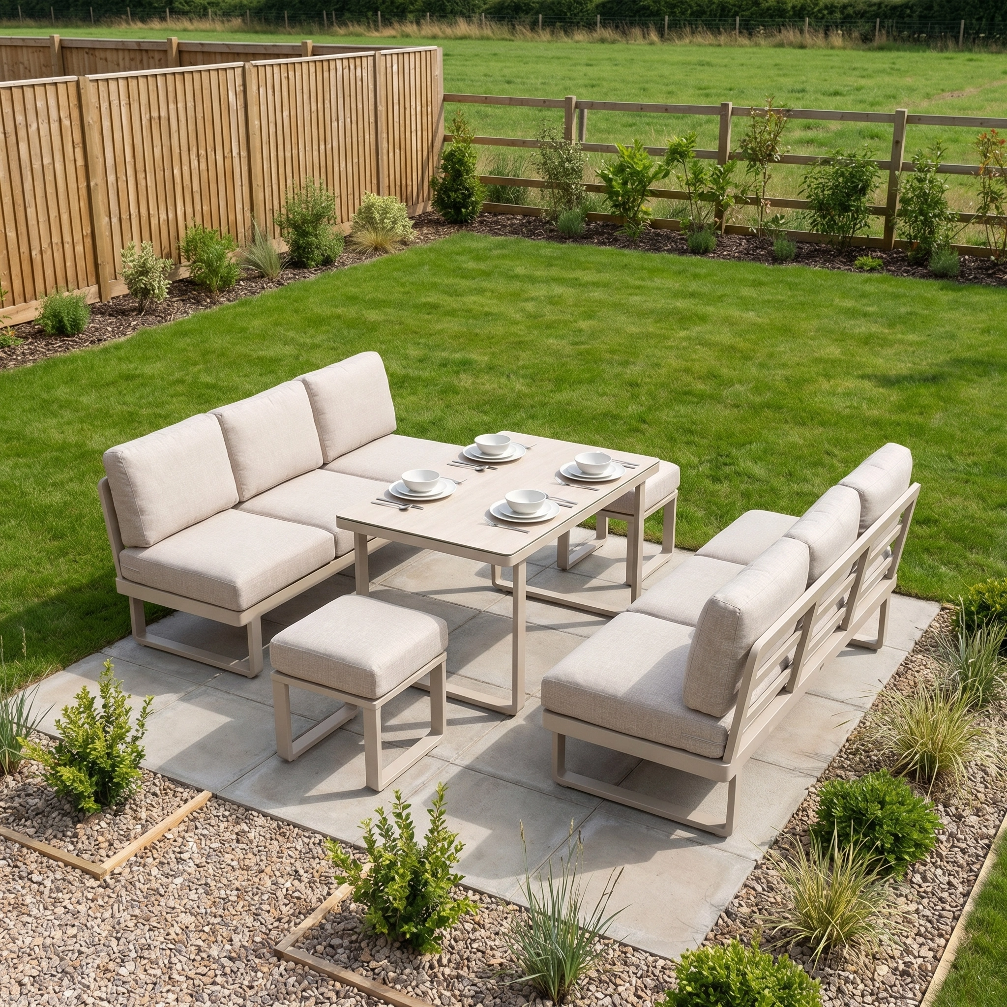 The outdoor patio showcases the Lyra Corner Dining Set in Latte, with cream cushioned seating for six around a stylish table, beautifully arranged on stone tiles within a landscaped garden.