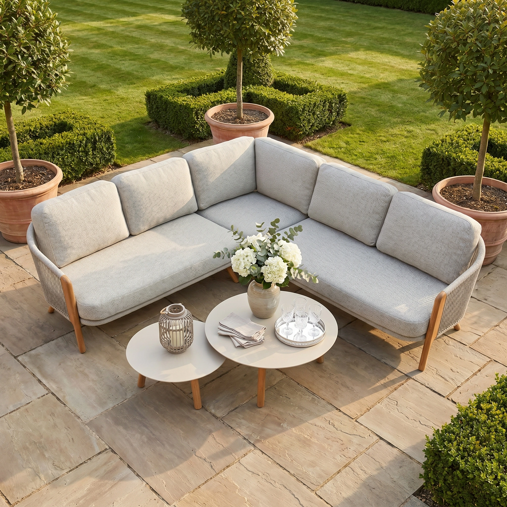 The Merano Corner Group Set with Coffee Table in Latte features an outdoor sectional sofa with cushions and a coffee table, accented by stylish olefin rope weave for a modern touch to your patio ensemble.