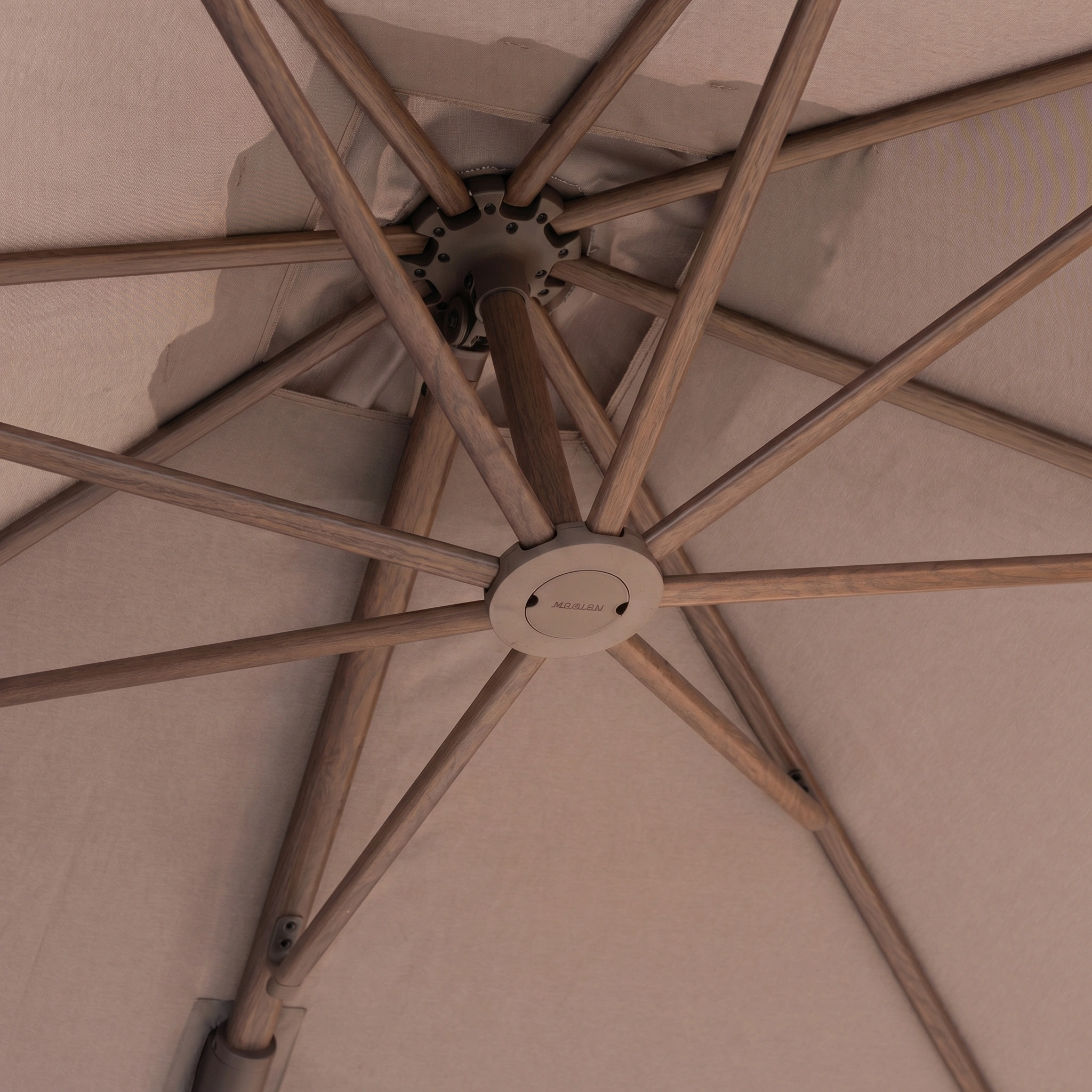 Close-up of the Nexus T2 Premium 3m Square Cantilever Parasol in Deep Taupe with sturdy wooden spokes and a 90kg granite base, offering stylish shade for your garden furniture.