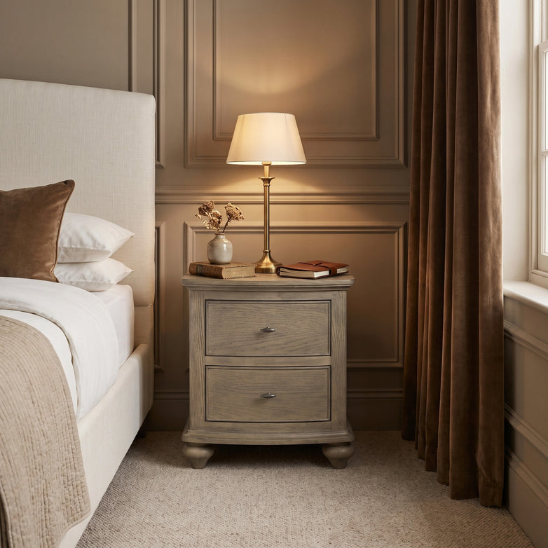 a nightstand next to a bed