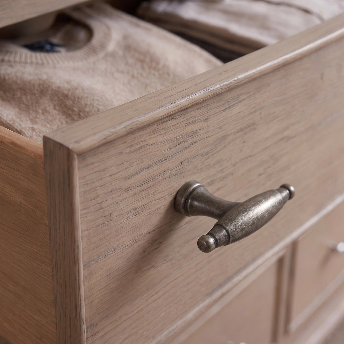 a drawer with a sweater inside