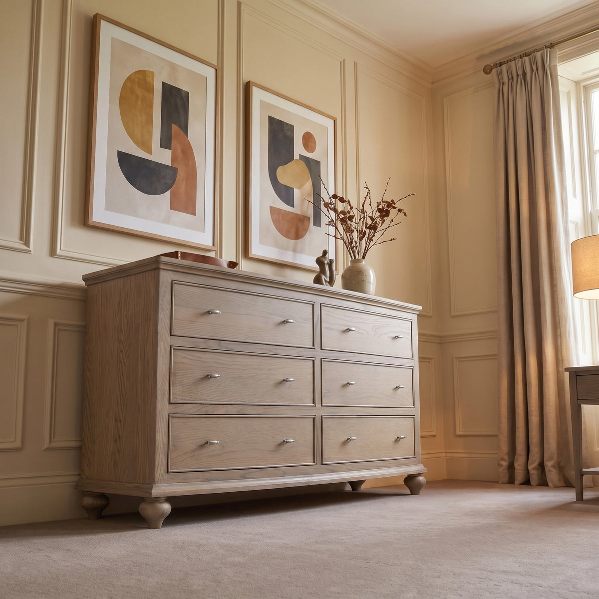a dresser and lamp in a room