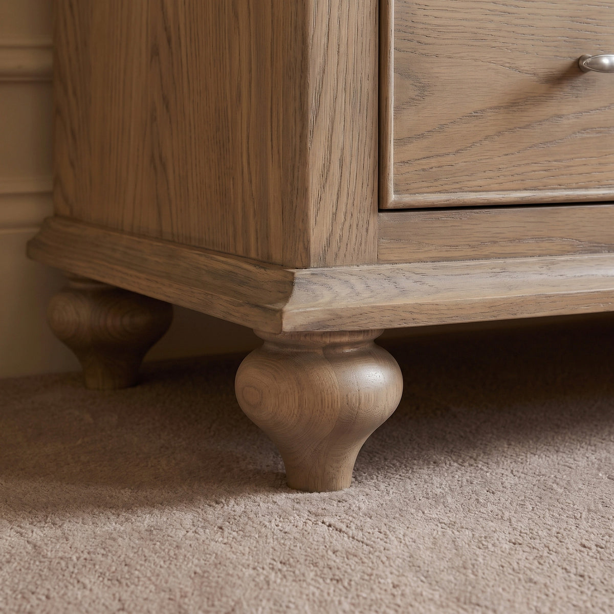 a wooden furniture legs on carpet