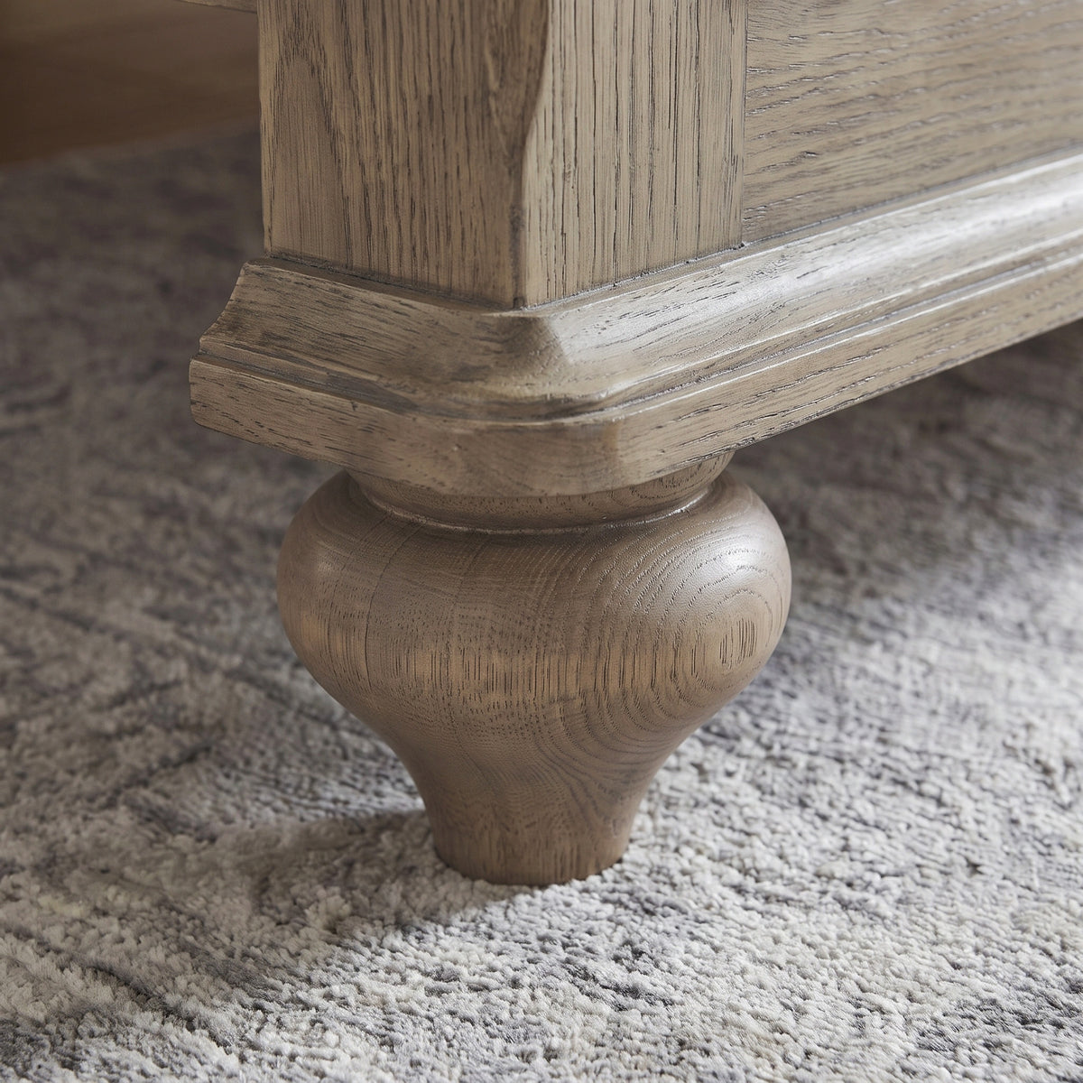 a wooden leg on a carpet